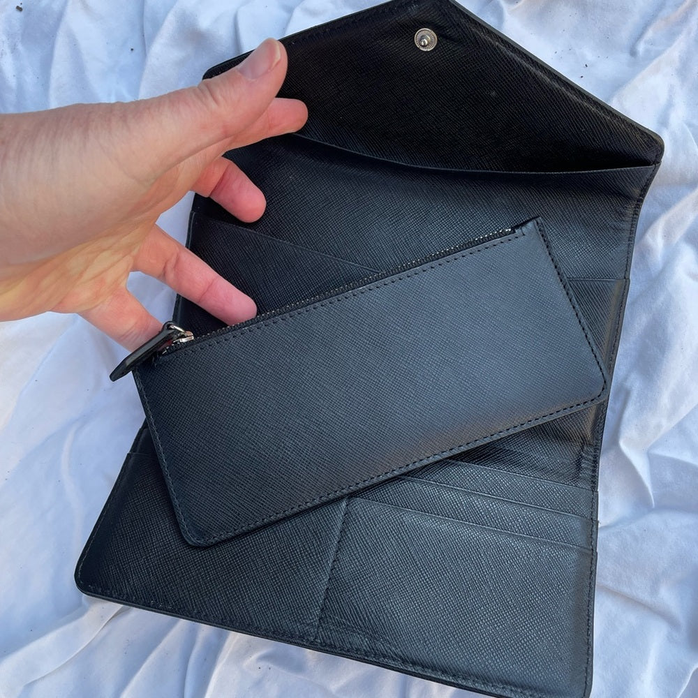 Roots black leather wallet, 7.5” x 4” x 0.5”
