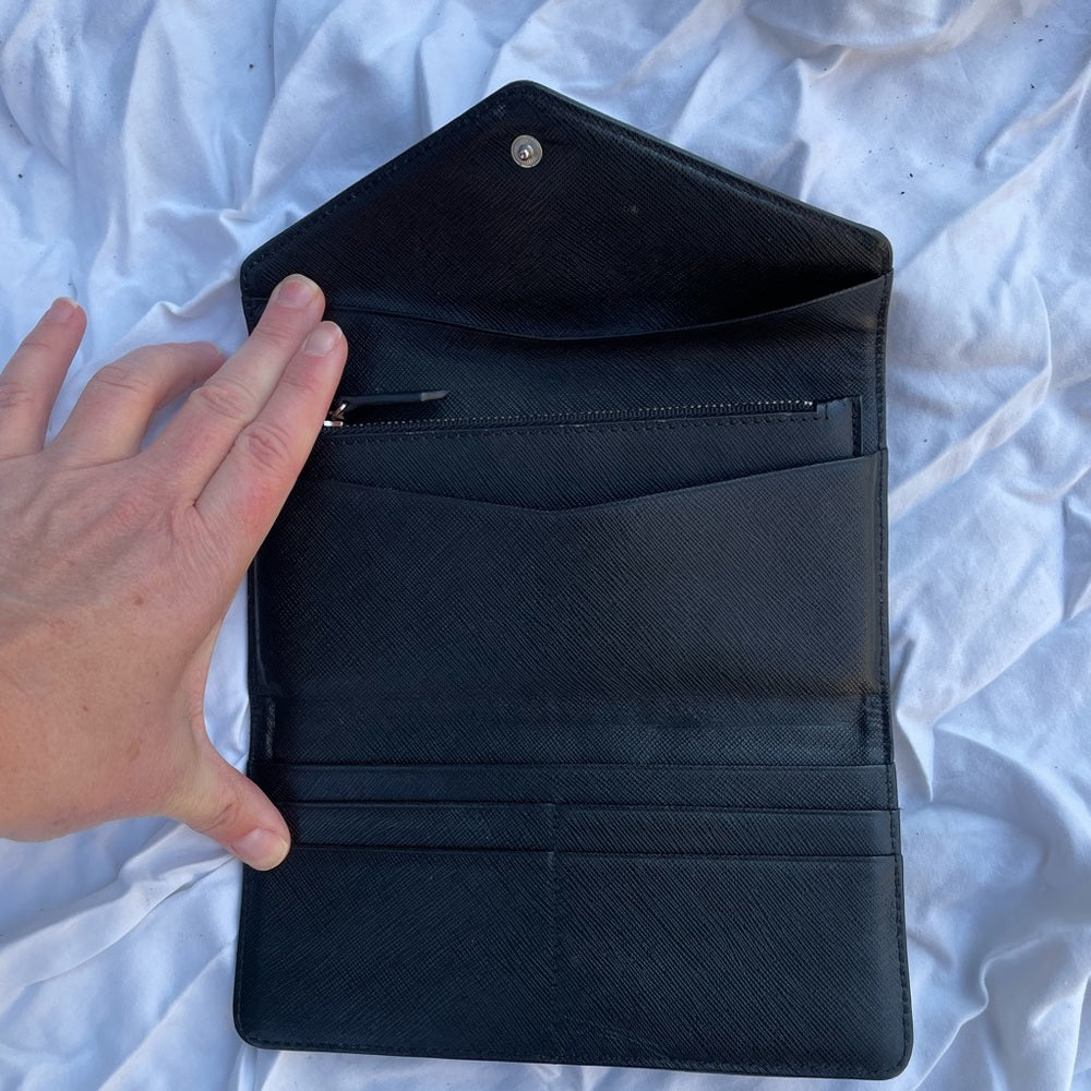 Roots black leather wallet, 7.5” x 4” x 0.5”
