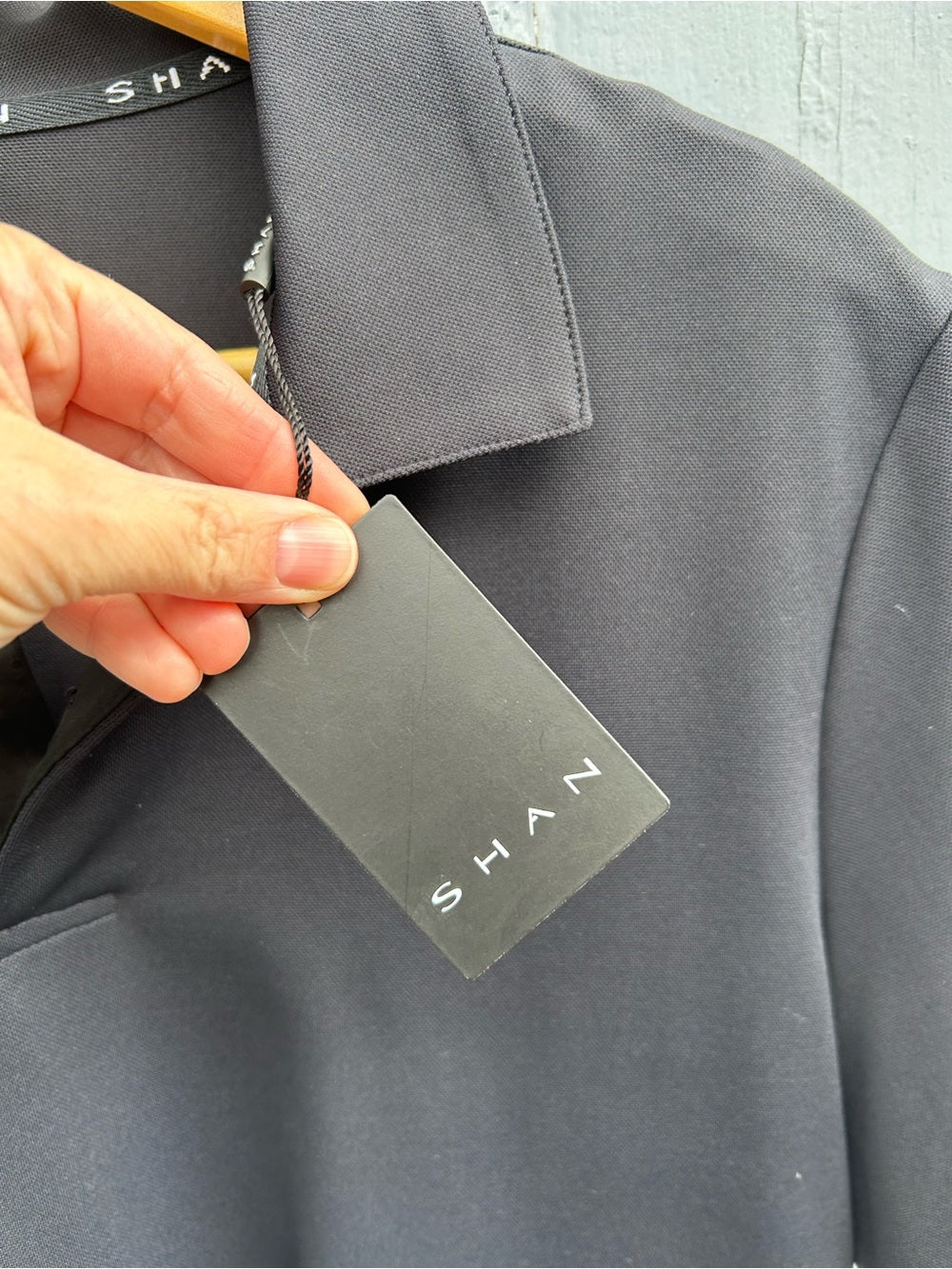 Shan Actuel Polo, black, BNWT, size L